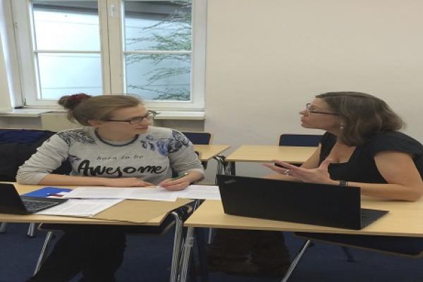 Dr. Brintlinger working with a student in Warsaw